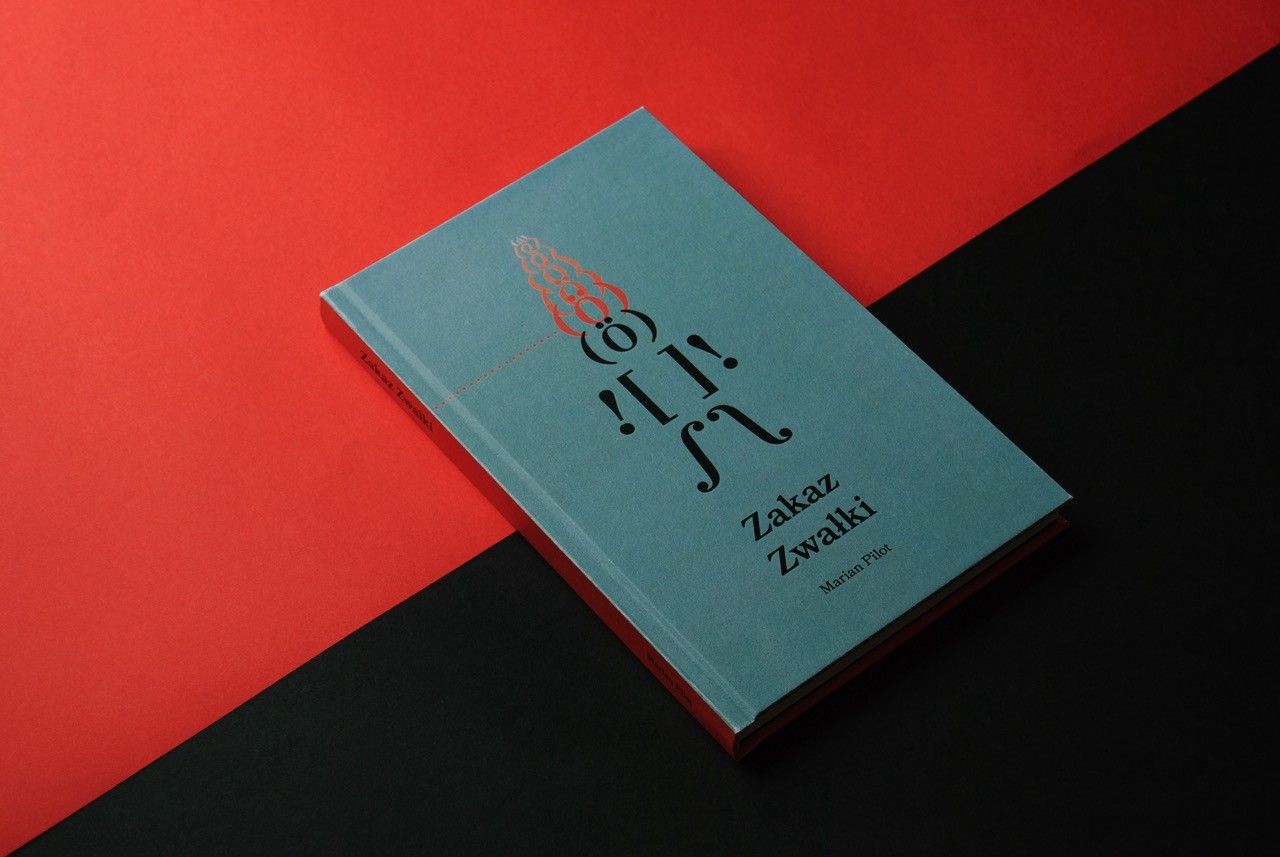 Teal hardcover of “Zakaz Zwałki” on a red and black background