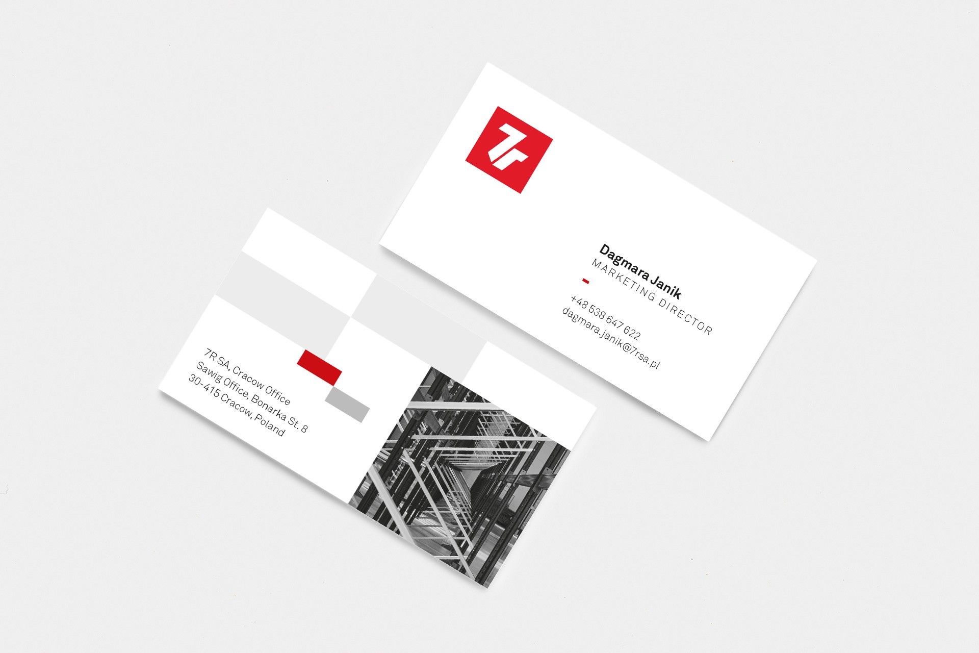 7R business cards with the red logo on a light background